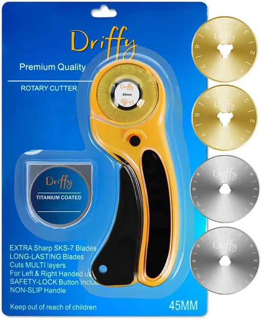 The Driffy 45mm rotary cutter on its blue blister card with four spare blades, two gold titanium coated and two steel