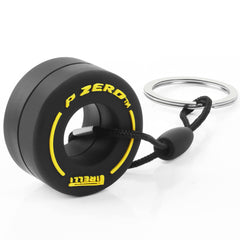 TRIXES Yellow Racing Car Wheel Keyring – Small Keychain - Formula 1 Fan Merchandise - Gifts for Men – Includes: Rubber Tyre Chain & Stainless-Steel Ring to Attach to your Keys Bag or Use for Display