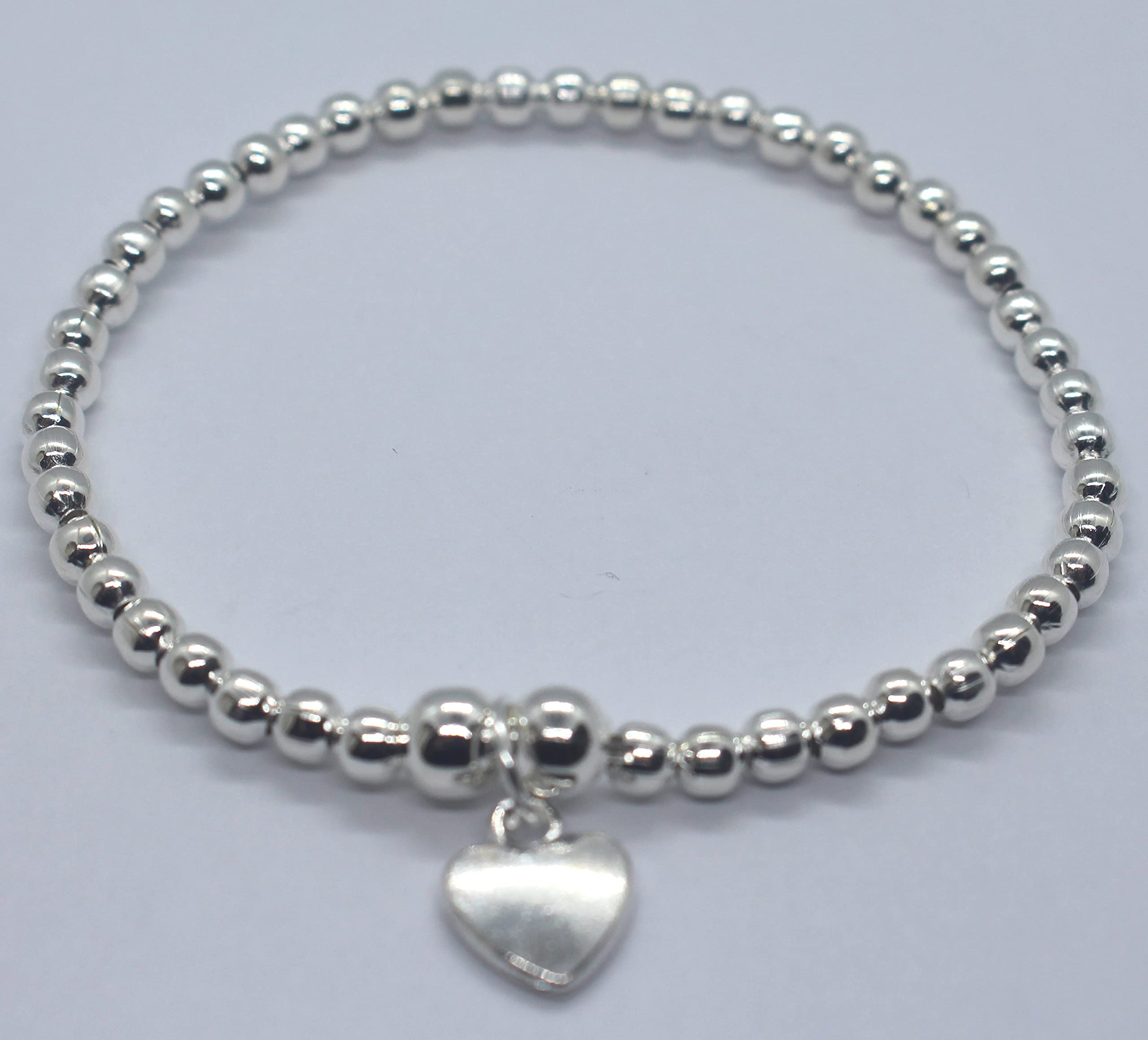 Silver Colour Round Beads With Heart Charm Stretchable Bracelet