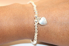 Silver Colour Round Beads With Heart Charm Stretchable Bracelet